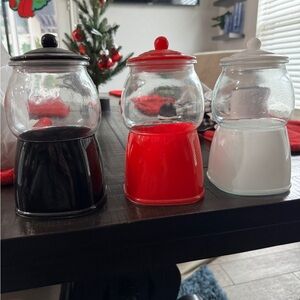 Three glass gumball machines